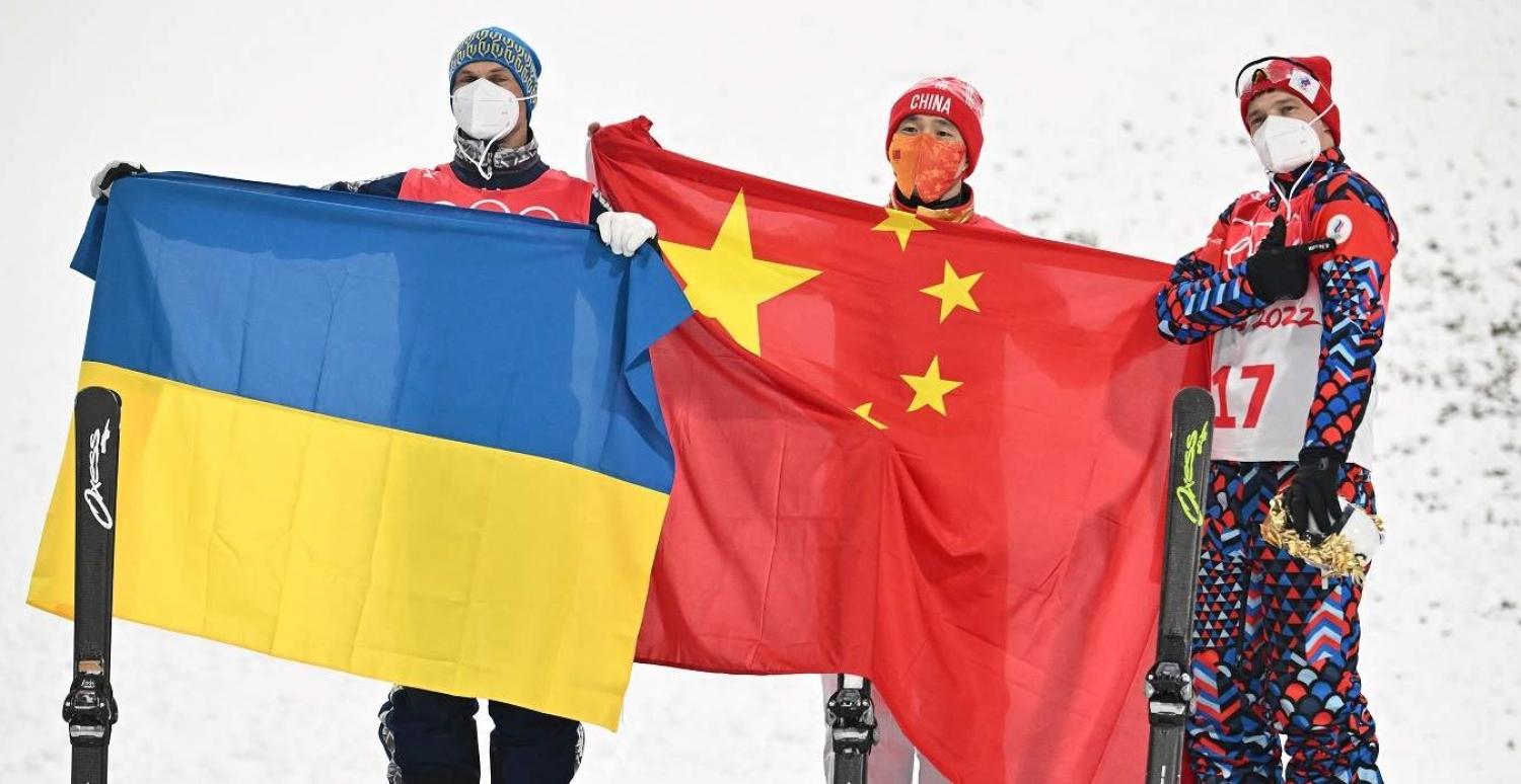 Ukraine's Oleksandr Abramenko, China's Qi Guangpu and Russia's Ilia Burov on the podium during the Beijing 2022 Winter Olympics, Zhangjiakou, China, 16 February 2022 (Marco Bertorello/AFP via Getty Images)