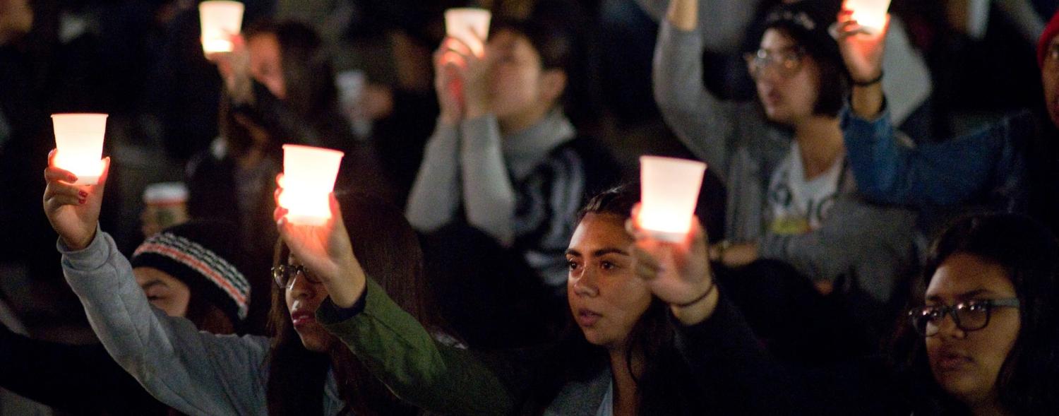 A candlelit vigil for victims of 2015 terrorist attacks in Paris, Beirut, and Baghdad. (Photo: Flickr/UCI)
