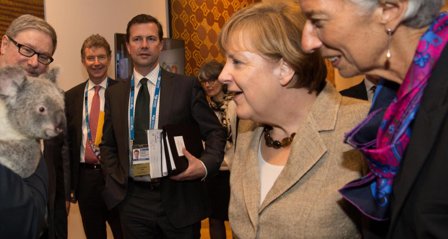 Germany's Chancellor Angela Merkel and IMF President Christine Lagarde meet a local at the G20 (Photo: Andrew Taylor/Getty Images)