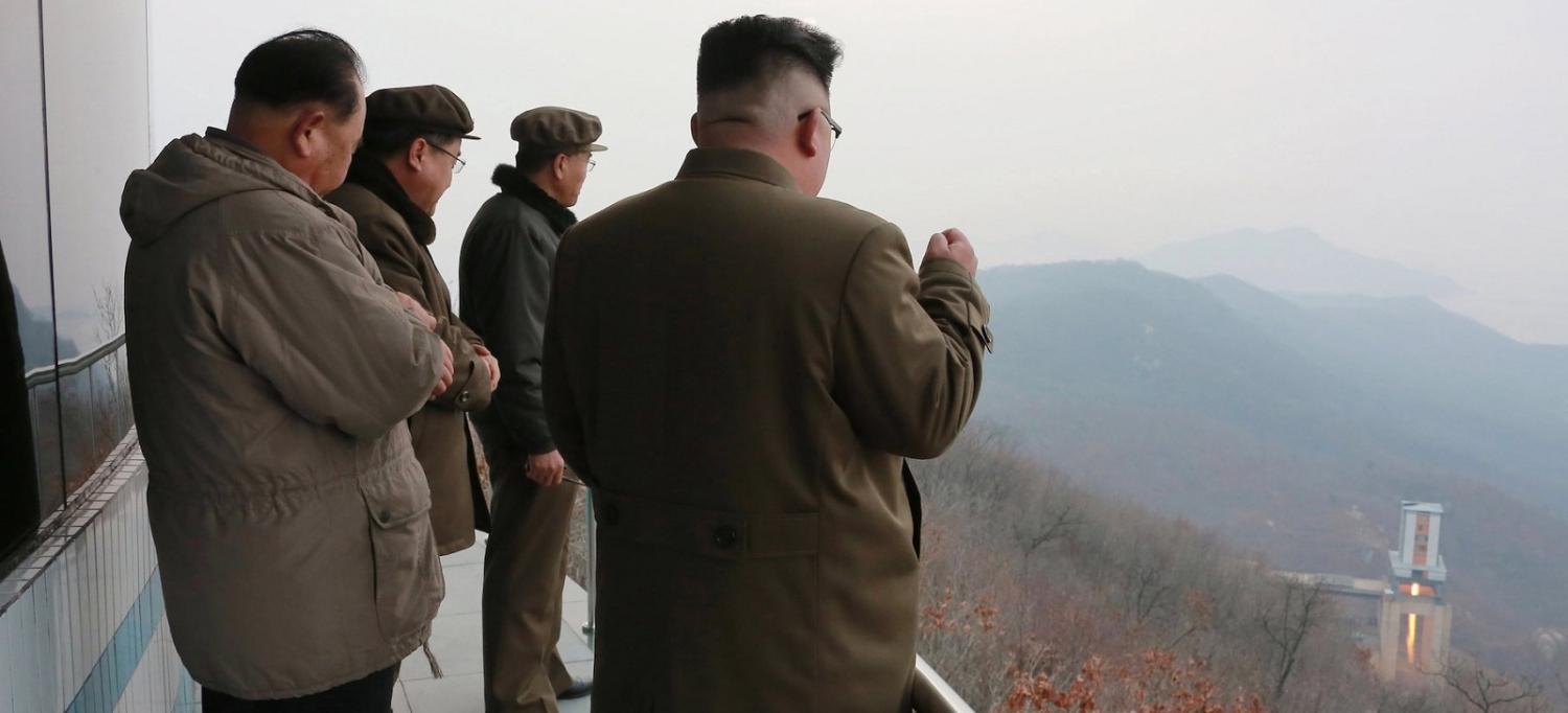 This picture released by North Korea's Korean Central News Agency on 19 March shows North Korean leader Kim Jong-Un at a test of a high-thrust engine at a satellite launching ground.