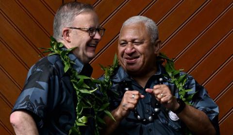 Australian Prime Minister Anthony Albanese, left, with Fiji prime minister Frank Bainimarama at the Pacific Islands Forum in Suva, 14 July (William West/AFP via Getty Images)