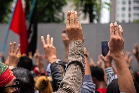 Protesters make three-finger salute outside the Burmese embassy in Bangkok over the Myanmar military government's execution of four democracy activists, 26 July (Peerapon Boonyakiat/SOPA Images/LightRocket via Getty Images)