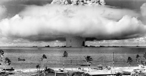 A mushroom-shaped cloud and water column from the underwater Baker nuclear explosion of 25 July 1946, Bikini Island (Pictures from History/Universal Images Group via Getty Images)