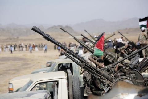 Tribesmen gather in Sanaa province controlled by the Iranian-backed Houthis in Yemen on 28 January, displaying Palestinian flags and protesting against the US and UK attacks over Yemen (Mohammed Hamoud/Anadolu via Getty Images)