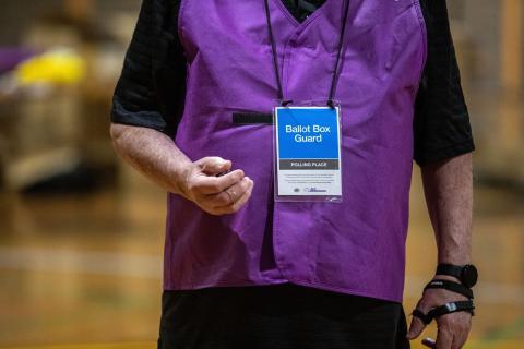 An AEC worker at a polling centre in Muswellbrook on 14 October 2023 during the referendum for Australians to decide on an Indigenous voice to parliament (Roni Bintang/Getty Images)