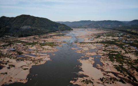 Record low levels on the Mekong River dividing the north-eastern Thai province of Loei, at left, with the Laos side seen at right, October 2019 (Lillian Suwanrumpha/AFP via Getty Images)