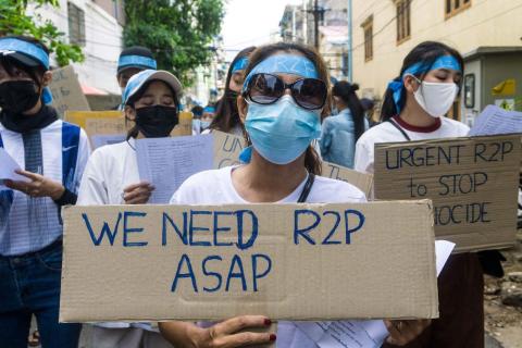 Protesters against the military coup in Myanmar call for international intervention, Yangon, 12 April 2021 (STR/AFP via Getty Images)
